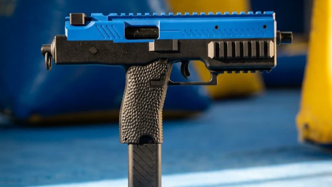 Side profile of the two-tone blue Vorsk VMP-1C SMG airsoft gun